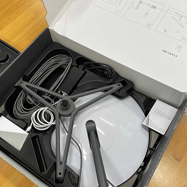 starlink dish box open with stand and cables